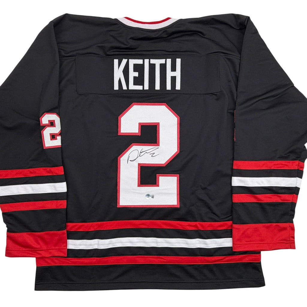 Autographed/Signed Duncan Keith Chicago Black Hockey Jersey Beckett BAS COA