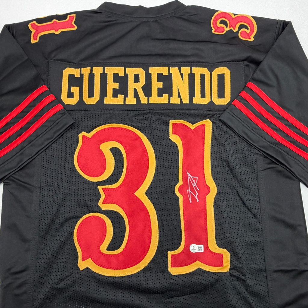 Autographed/Signed Isaac Guerendo San Francisco Black Rivalries Collection Football Jersey Beckett BAS COA