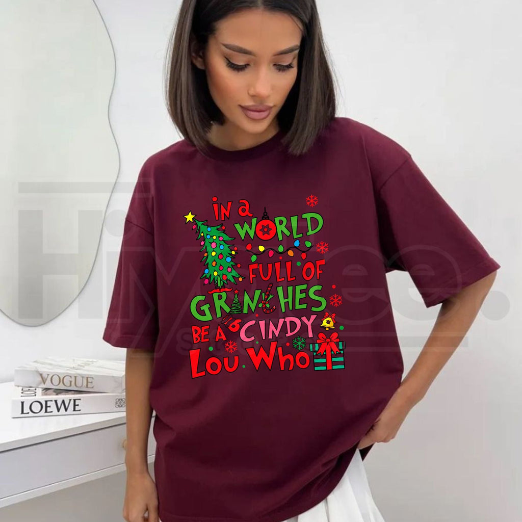 In a World Full of Grinches Be a Cindy Lou Who T-Shirt – Inspirational Christmas Holiday Graphic Tee