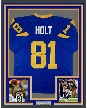 Framed Autographed/Signed Torry Holt 35x39 St. Louis Retro Blue Football Jersey Beckett BAS COA