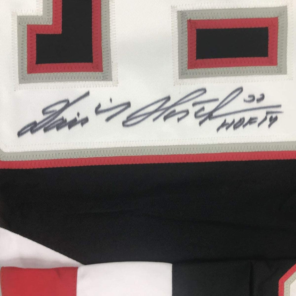 Framed Autographed/Signed Dominik Hasek HOF 14 35x39 Buffalo Black Hockey Jersey JSA COA
