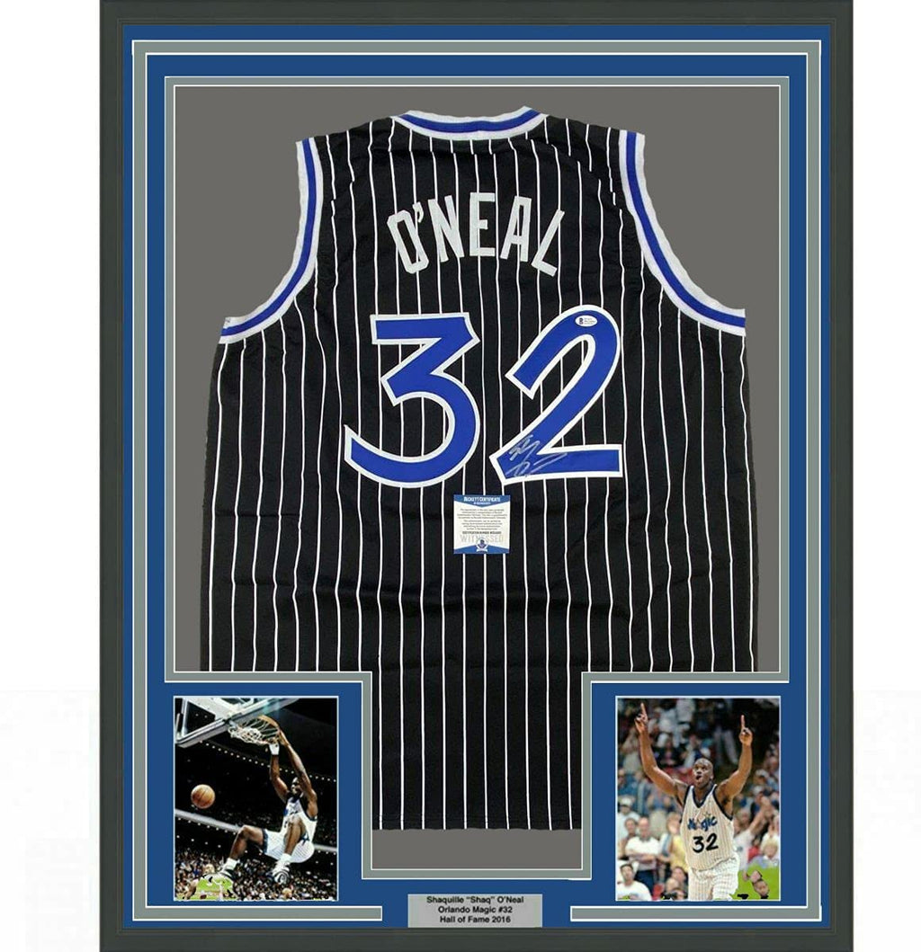 Framed Autographed/Signed Shaquille Shaq O'Neal 35x39 Orlando Black Pinstripe Basketball Jersey Beckett BAS COA