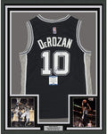 Framed Autographed/Signed DeMar DeRozan 35x39 San Antonio Black Basketball Jersey Beckett BAS COA