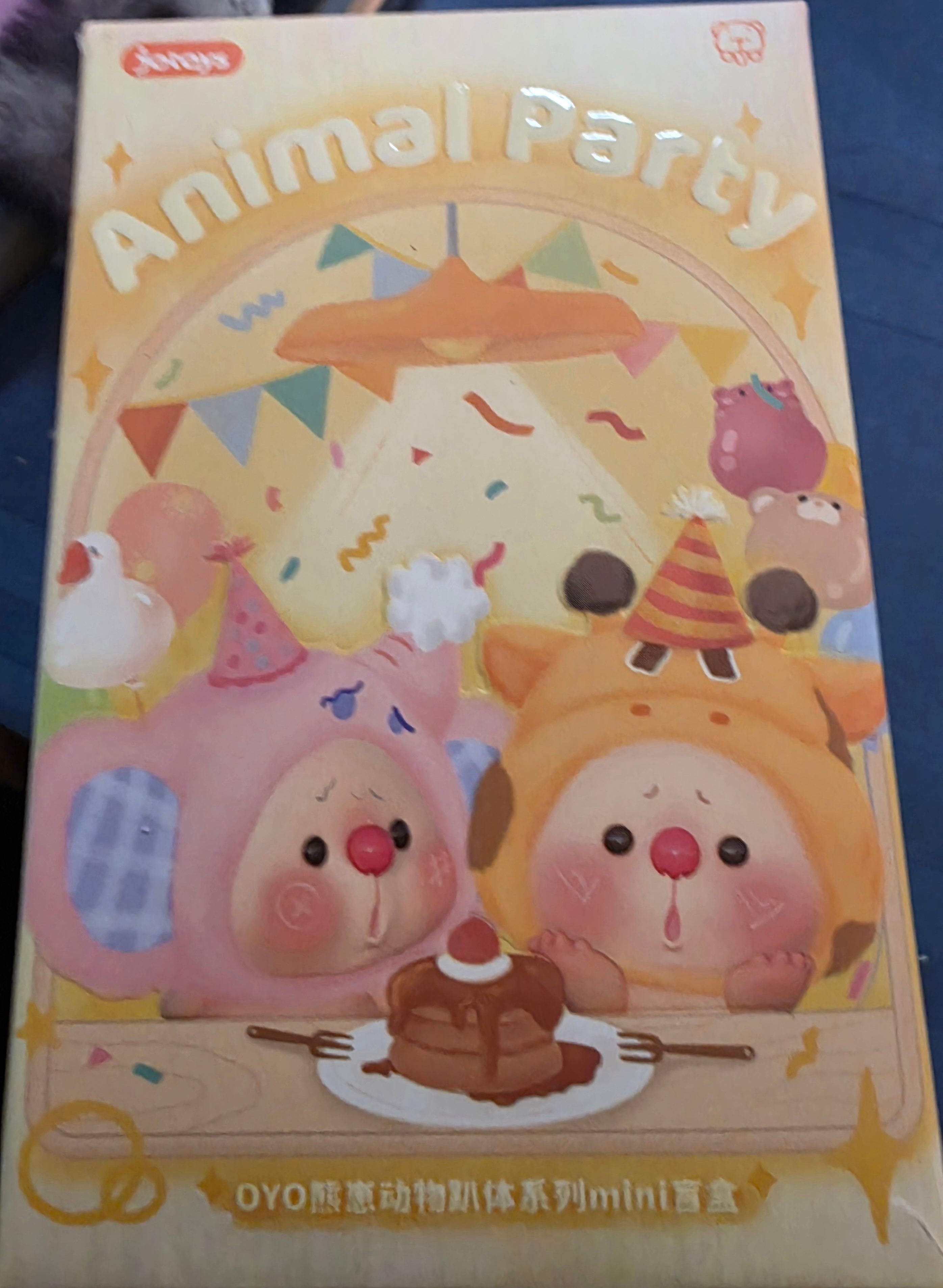 Children's toy packaging with cartoon animals and festive design
