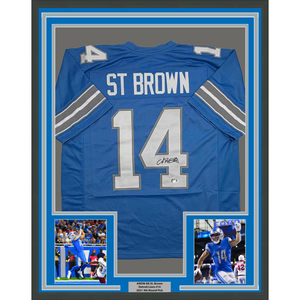 Framed Autographed/Signed Amon-Ra St. Brown 35x39 Detroit Current Blue Football Jersey Beckett BAS COA