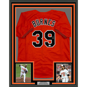 Framed Autographed/Signed Corbin Burnes 35x39 Baltimore Orange Baseball Jersey Beckett BAS COA