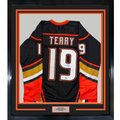 Framed Autographed/Signed Troy Terry 35x39 Anaheim Black Hockey Jersey Beckett BAS COA