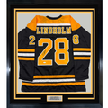 Framed Autographed/Signed Elias Lindholm 35x39 Boston Black Hockey Jersey JSA COA