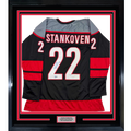 Framed Autographed/Signed Logan Stankoven 35x39 Carolina Black Hockey Jersey Beckett BAS COA