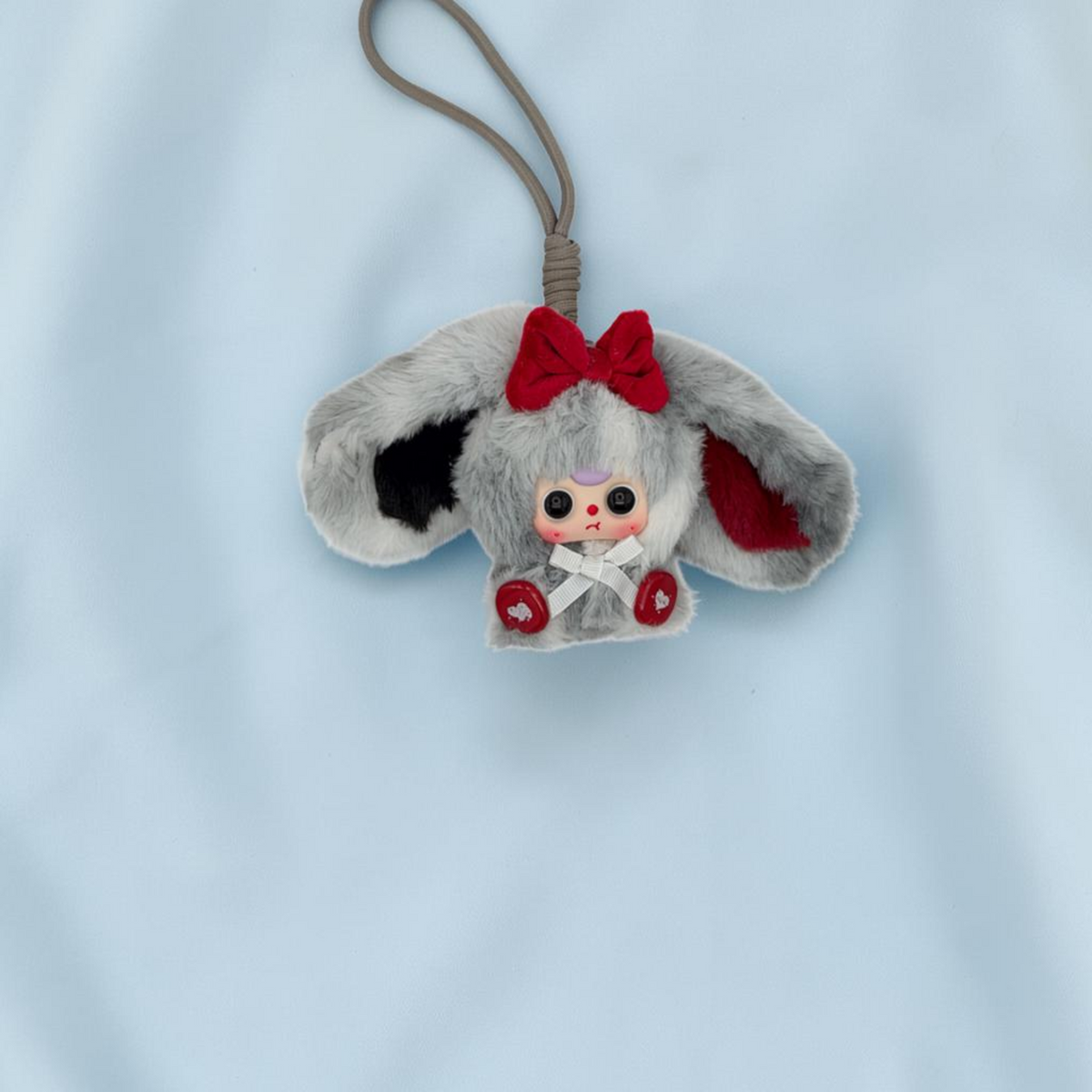 Momof2boyz Shop Baby Three Alice Rabbit Town plush keychain with grey fur, red bow, and heart-detailed feet.