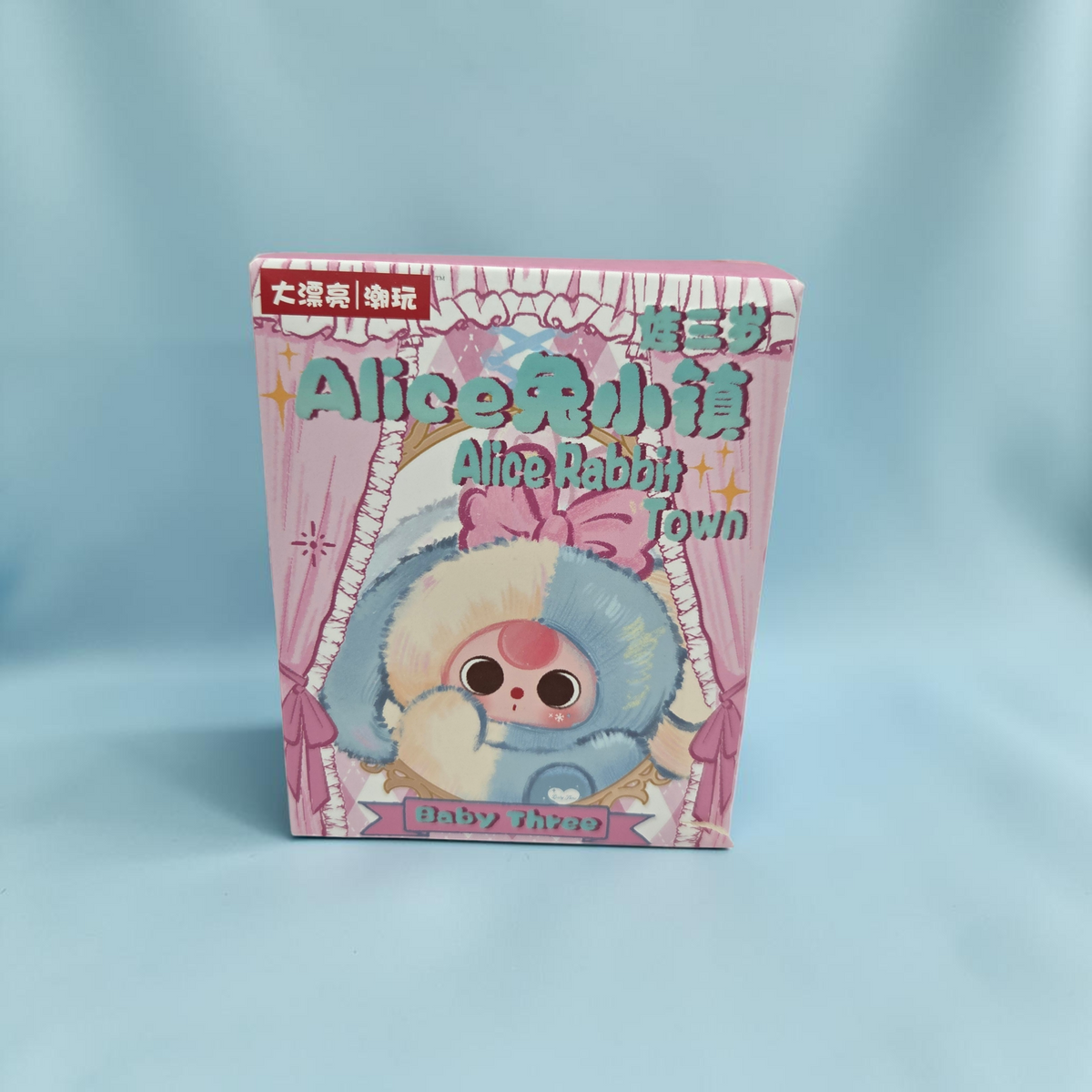 Momof2boyz Shop Baby Three Alice Rabbit Town blind box featuring a cute plush rabbit illustration on pink packaging