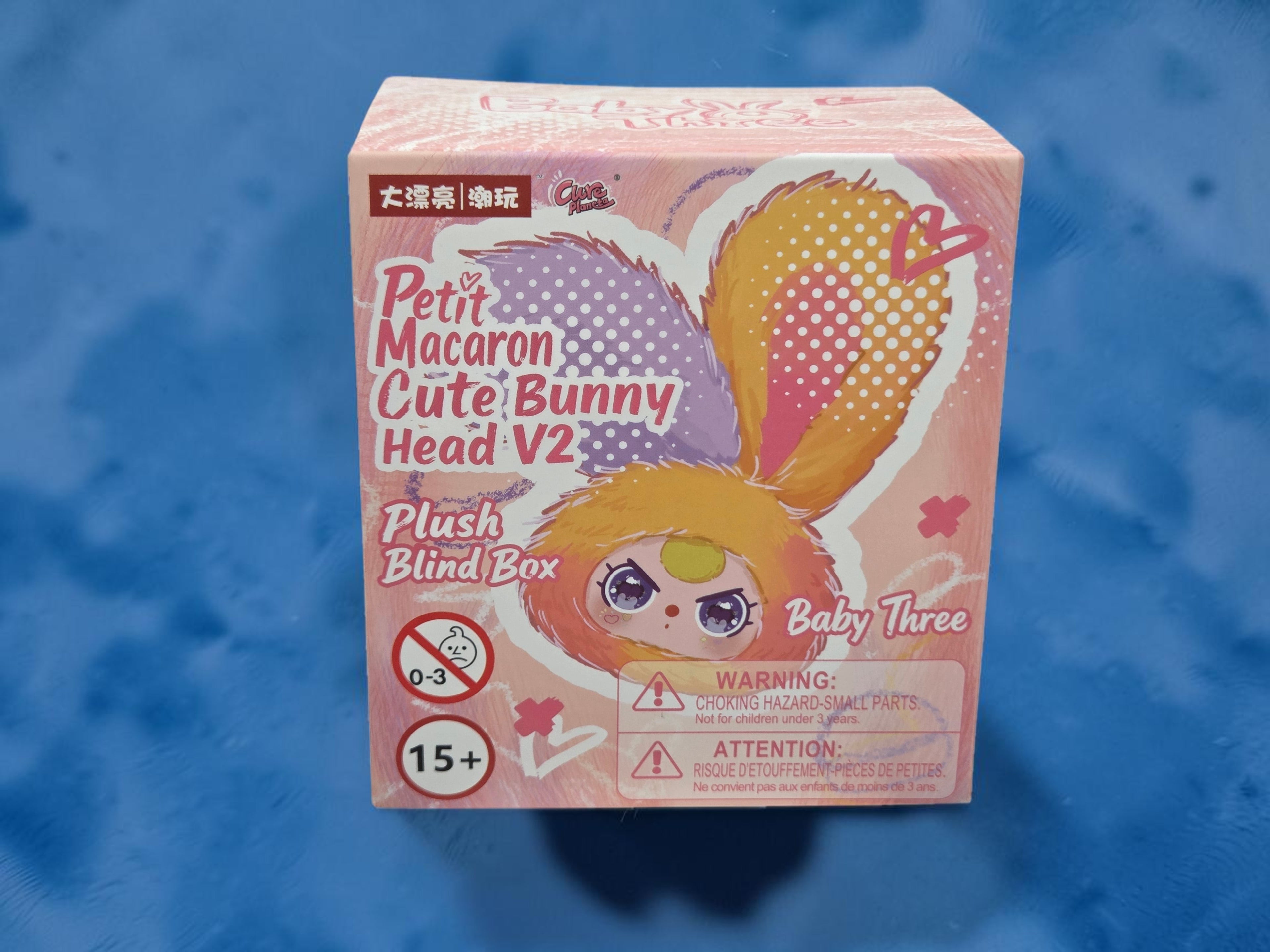 Momof2boyz Shop Baby Three Petit Macaron Cute Bunny Head V2 plush blind box collectible in Vanilla Dream colorway.