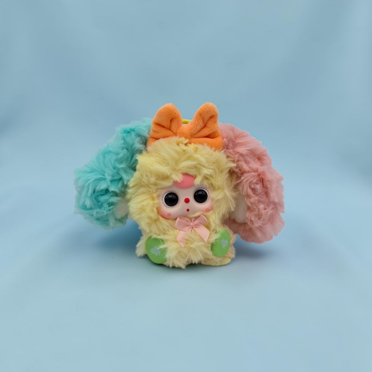 Momof2boyz Shop Baby Three Alice Rabbit Town plush keychain with yellow fur, orange bow, and pastel ear accents.
