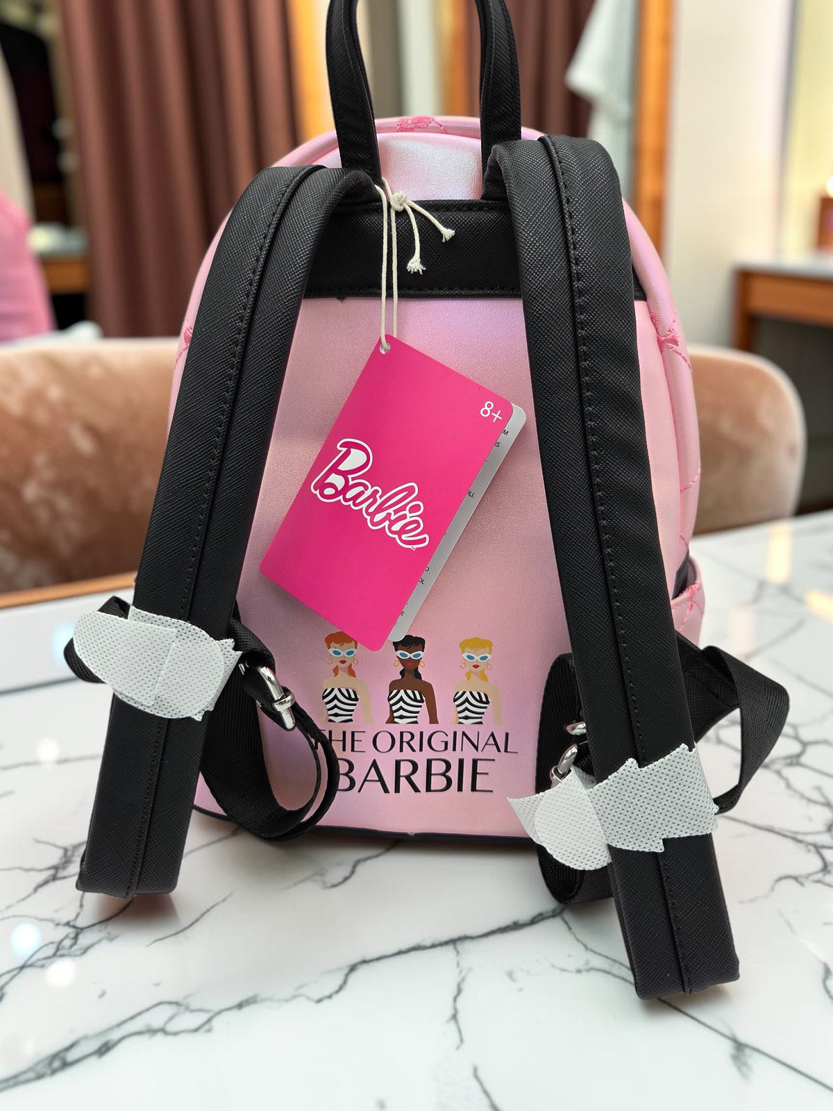 Momof2boyz Shop Loungefly Barbie mini backpack featuring a pink quilted back with The Original Barbie graphic print