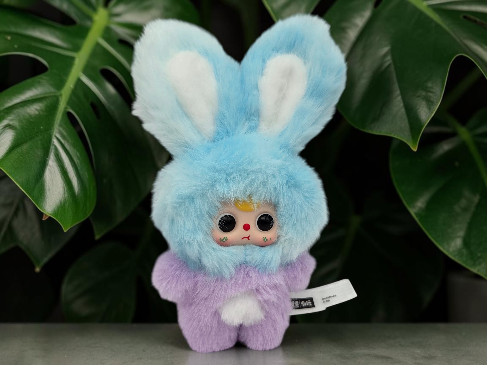 Momof2boyz Shop BB3 Petit Macaron Cute Bunny plush figure in ink blue and pastel purple against green leaves