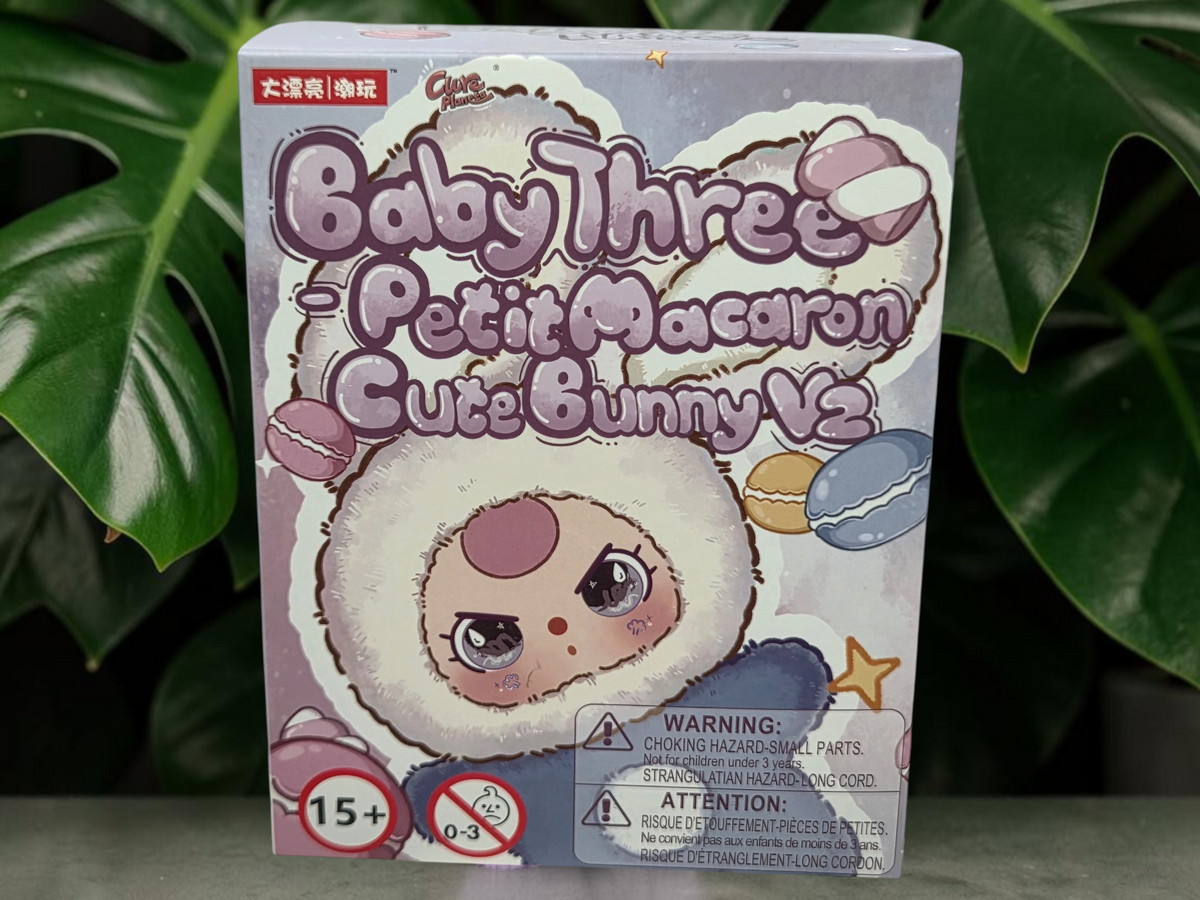 Momof2boyz Shop BB3 Petit Macaron Cute Bunny blind box featuring an ink blue bunny character in a pastel box.