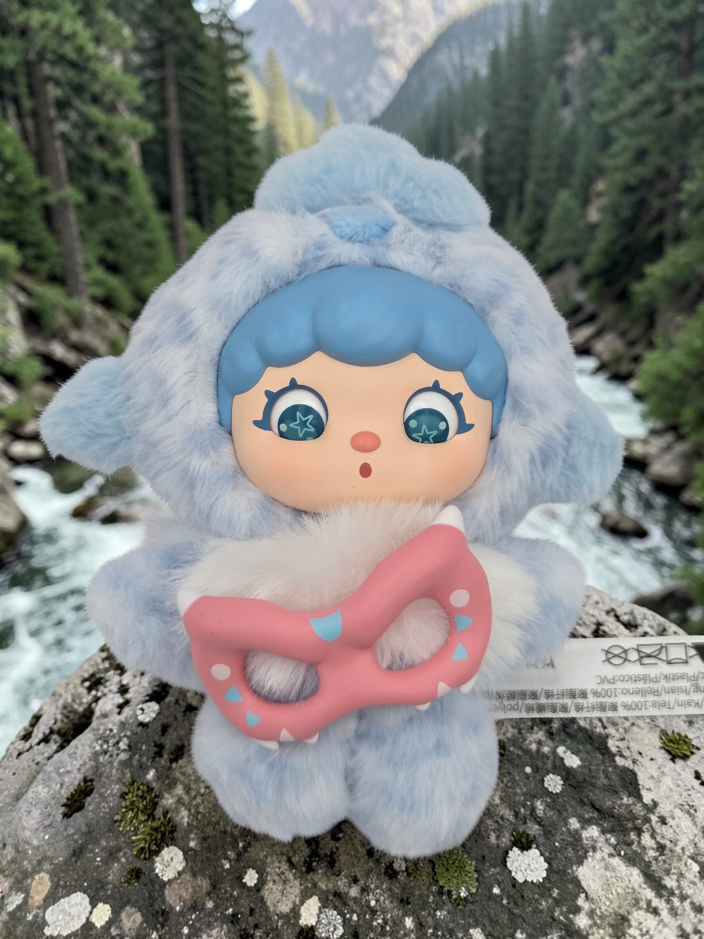 Momof2boyz Shop Mochi Little Monster plush keychain with blue fur, star eyes, and a pink removable monster mask.