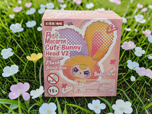 Momof2boyz Shop Baby Three Petit Macaron Cute Bunny Head V2 plush blind box, yellow and purple ears, cute collectible toy.