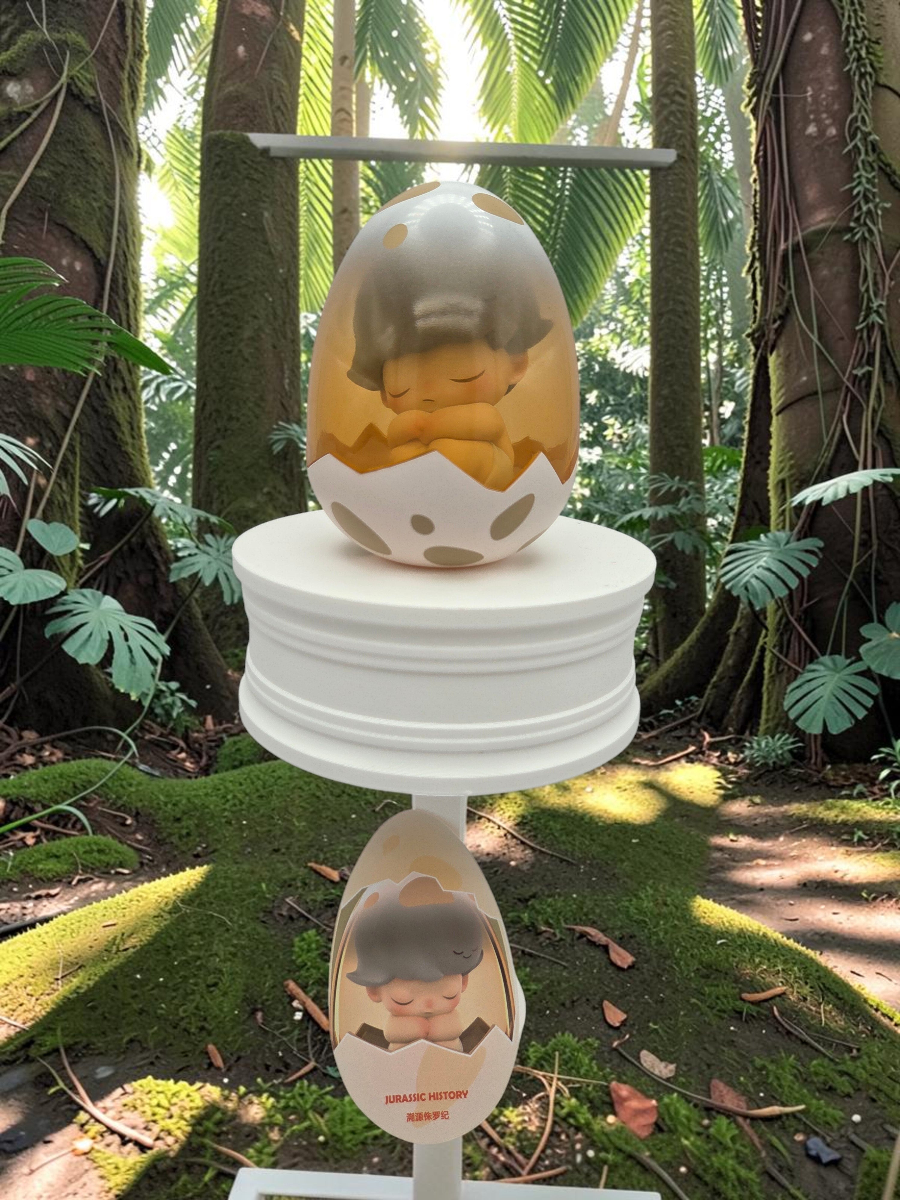 Momof2boyz Shop DIMOO Jurassic World collectible figure inside a spotted egg displayed on a white pedestal in a forest.