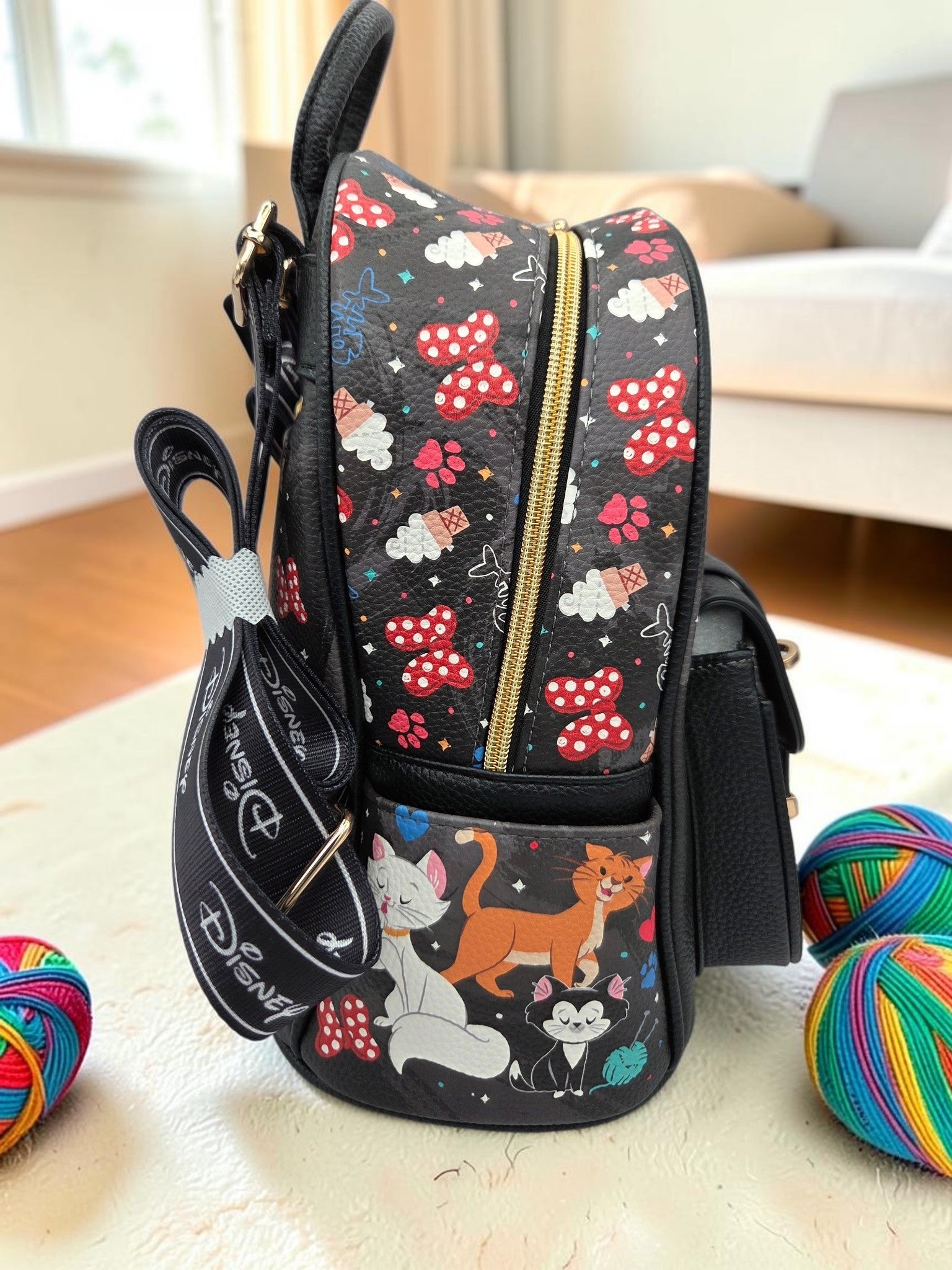 Momof2boyz Shop Disney cat themed mini backpack in black vegan leather with colorful character print and gold zipper
