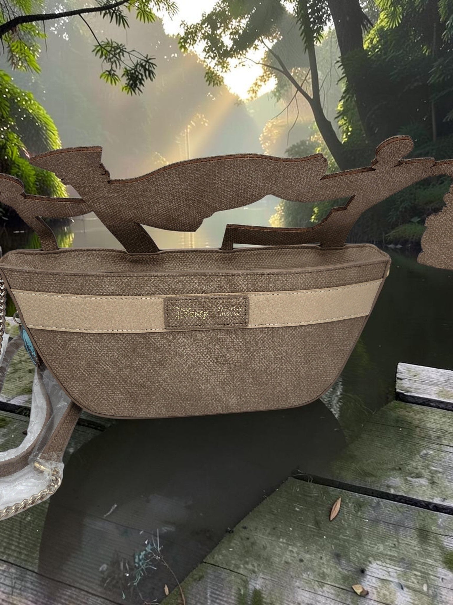Momof2boyz Shop Disney Jungle Cruise crossbody bag with 3D boat cutout design in earthy brown tones.