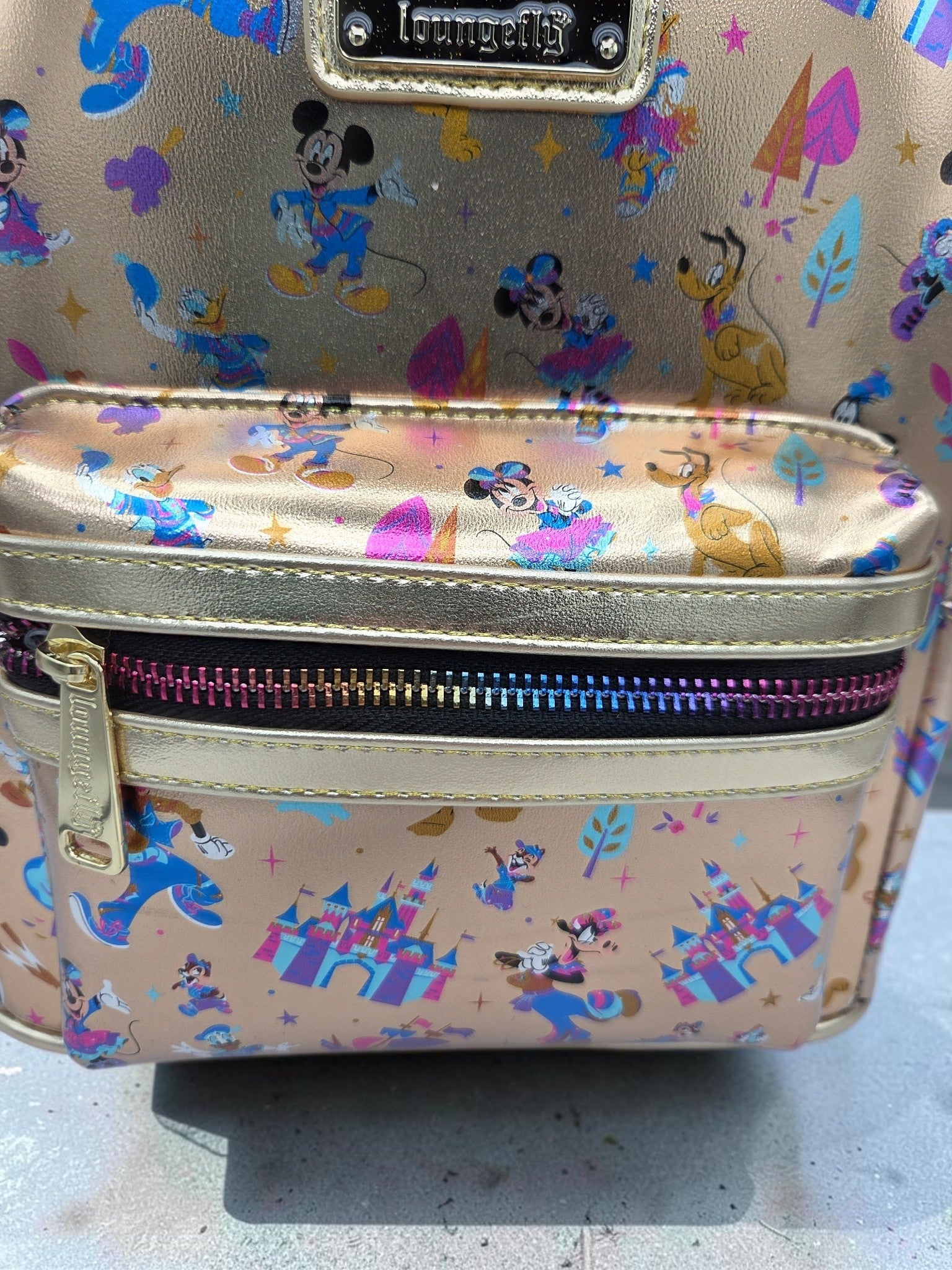 Momof2boyz Shop Disneyland 70th Anniversary mini backpack in metallic gold with colorful Disney character print