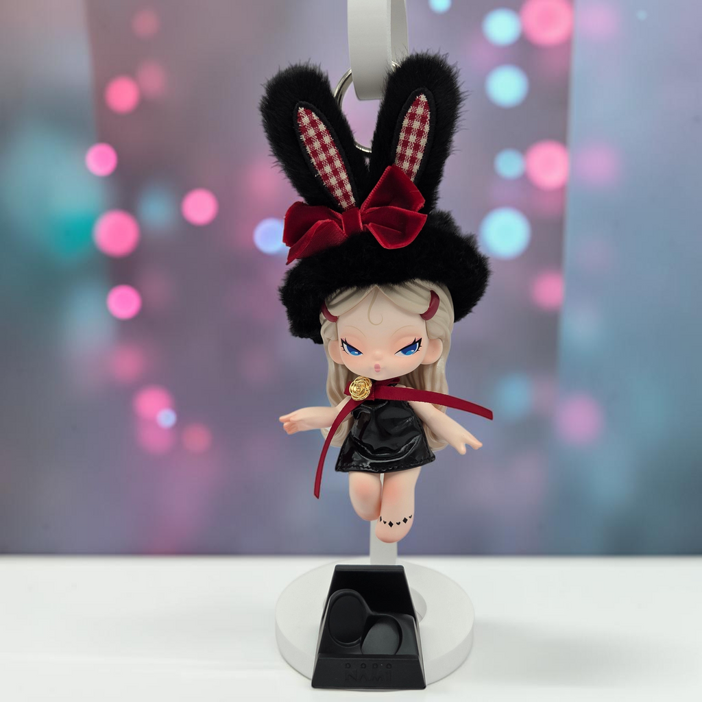 Momof2boyz Shop Dodo Nami Cheers Day collectible keychain figure with black bunny ears and a red bow