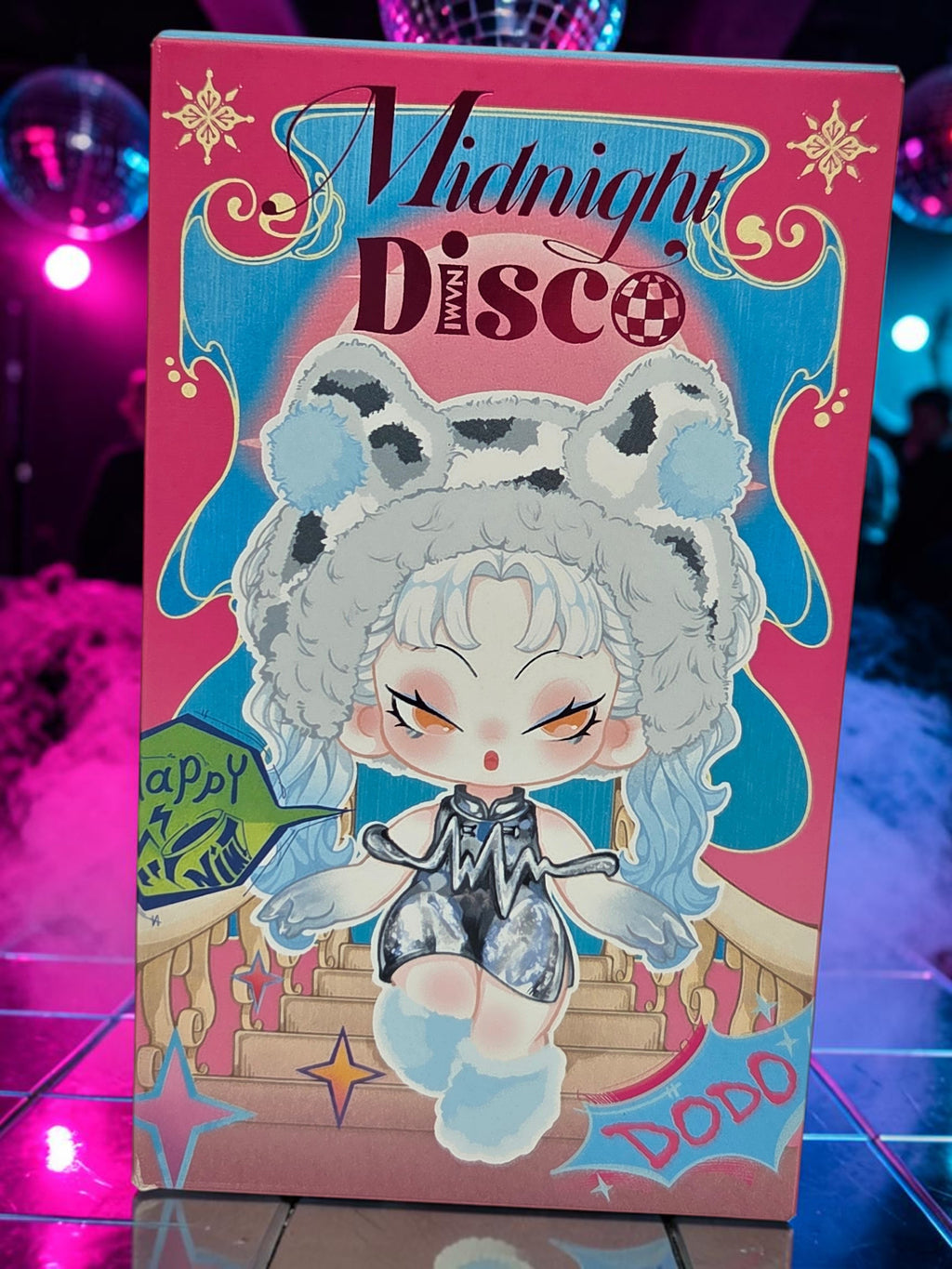 Momof2boyz Shop Dodo Nami Midnight Disco collectible character keychain box featuring a stylish leopard-themed figure