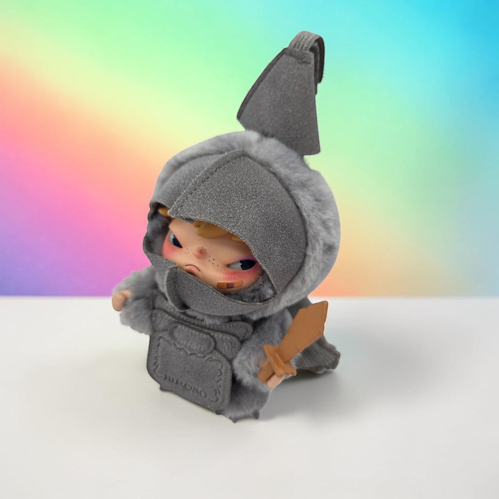 Momof2boyz Shop HIRONO Mist Walker art toy figure in a grey faux-fur hooded knight costume with a small wooden sword.