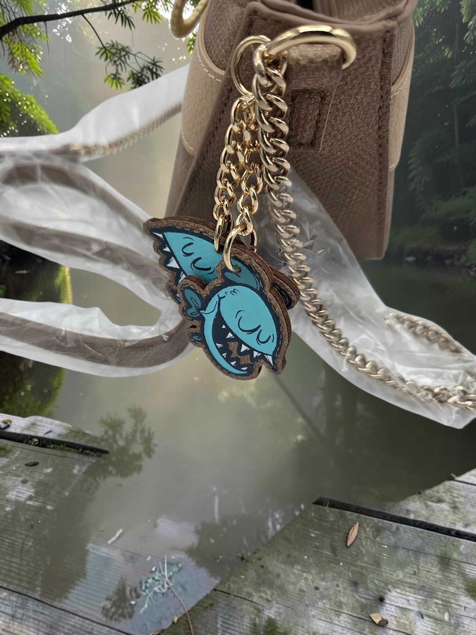 Momof2boyz Shop Disney Jungle Cruise crossbody bag featuring a gold chain strap and a playful piranha charm