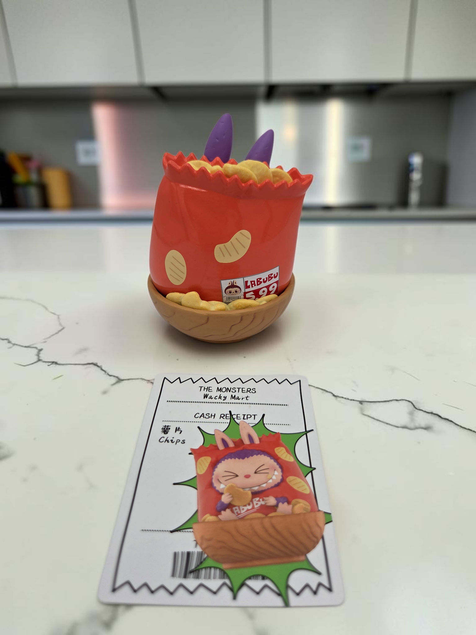 Momof2boyz Shop Labubu Monster's Wacky Mart chips collectible figure with character card on a kitchen counter