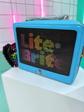 Momof2boyz Shop Lite-Brite blue crossbody bag with a retro toy-inspired pixelated display and heart coin purse.