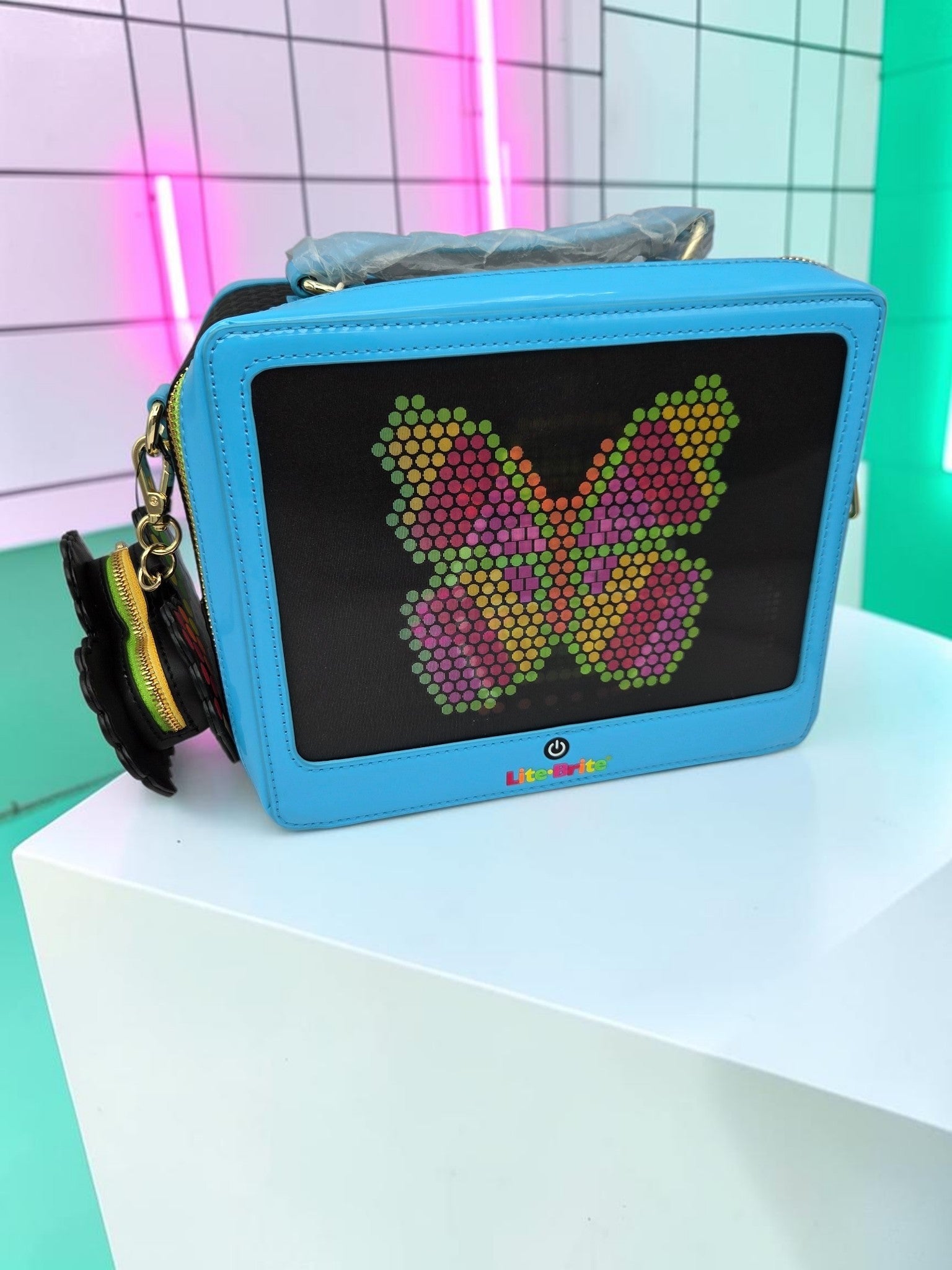 Momof2boyz Shop Loungefly Lite-Brite blue crossbody bag featuring a butterfly design and heart-shaped coin purse.
