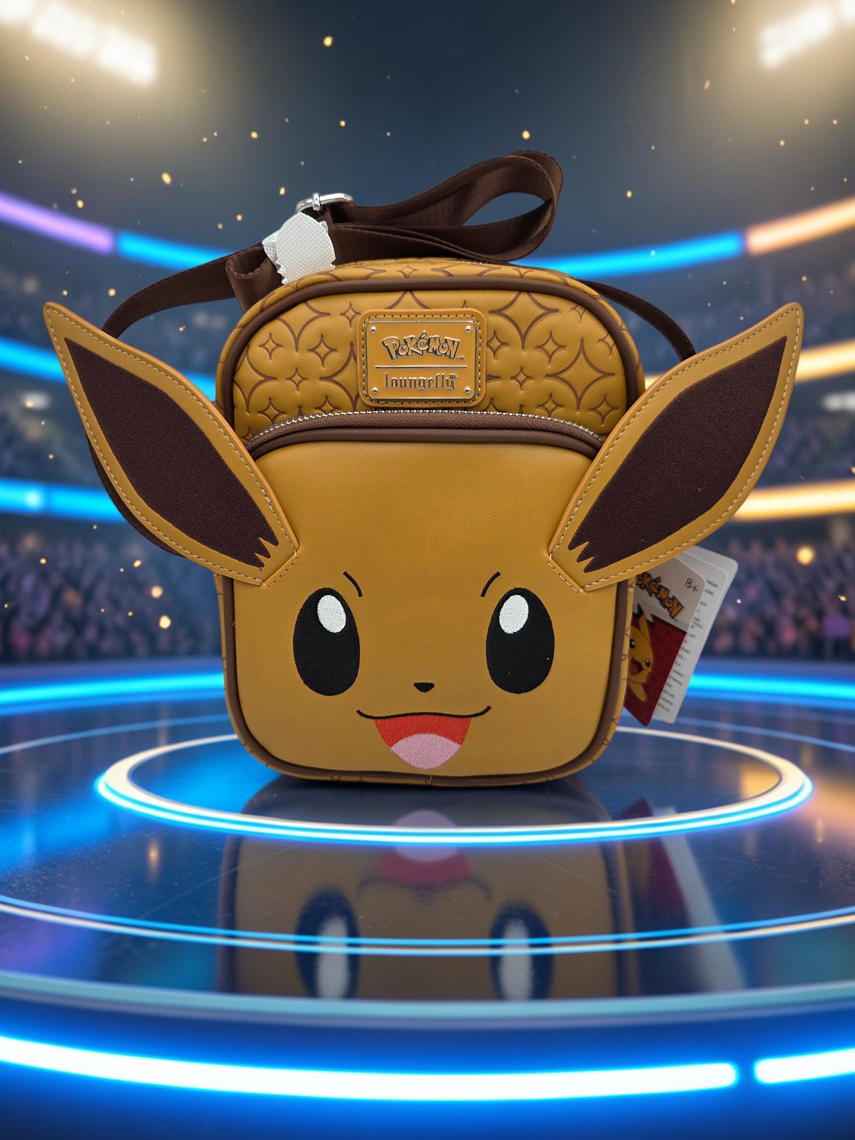 Momof2boyz Shop Loungefly Pokemon Eevee crossbody bag in brown vegan leather with signature ears and debossed pattern.
