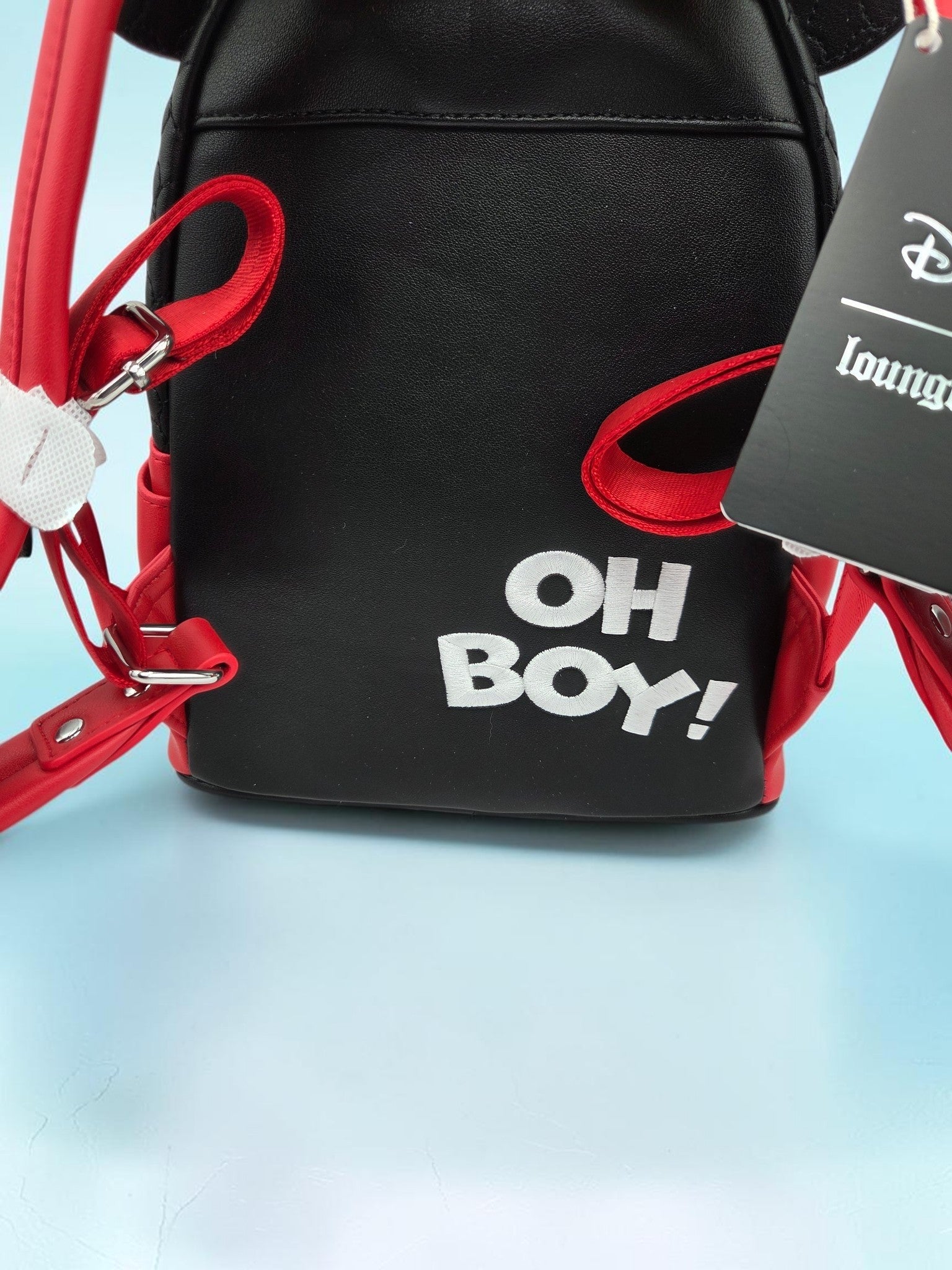 Back view of Momof2boyz Shop Disney Loungefly Mickey Mouse mini backpack featuring white OH BOY text on black leather