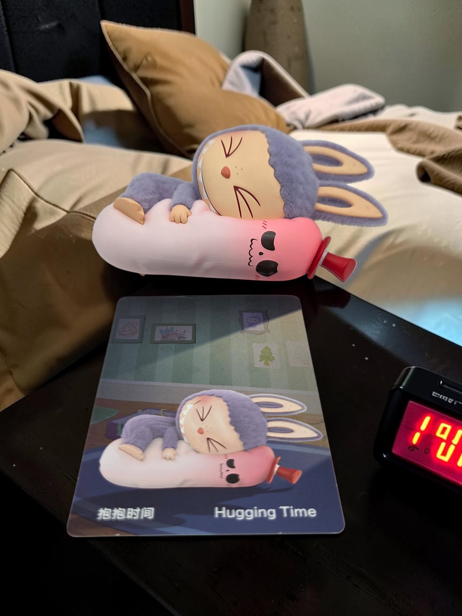 Momof2boyz Shop The Monster's 1:00 am Hugging Time collectible figure sleeping on a pink plush toy with character card