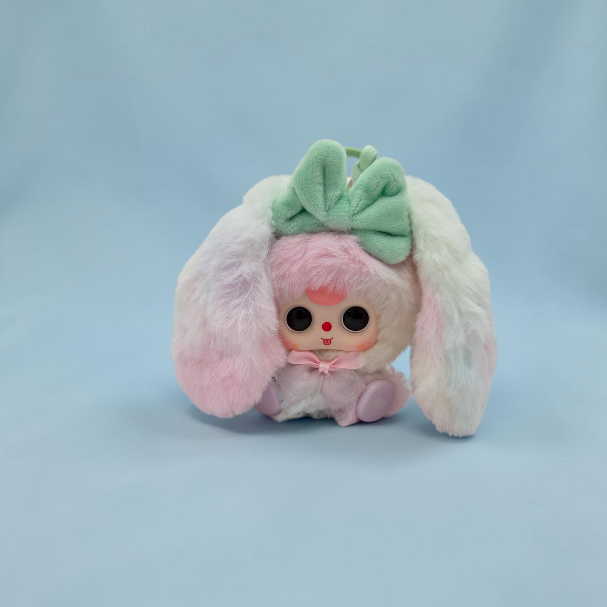 Momof2boyz Shop Baby Three Alice Rabbit Town plush keychain with pastel rainbow fur, mint green bow, and large eyes.