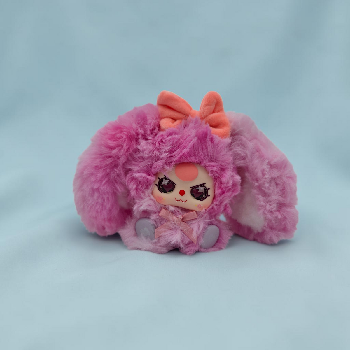 Momof2boyz Shop Baby Three Alice Rabbit Town plush keychain with pink fuzzy fur, peach bow, and large expressive eyes.