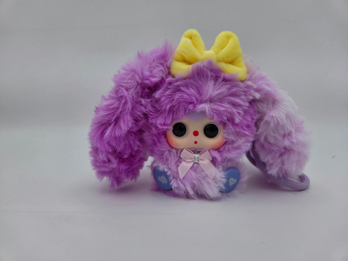 Momof2boyz Shop fuzzy purple rabbit plush keychain with a yellow bow and large expressive eyes
