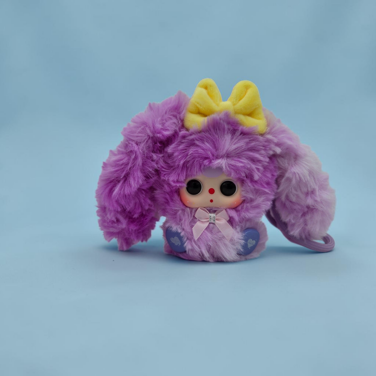 Momof2boyz Shop fuzzy purple rabbit plush keychain with a yellow bow and large expressive eyes