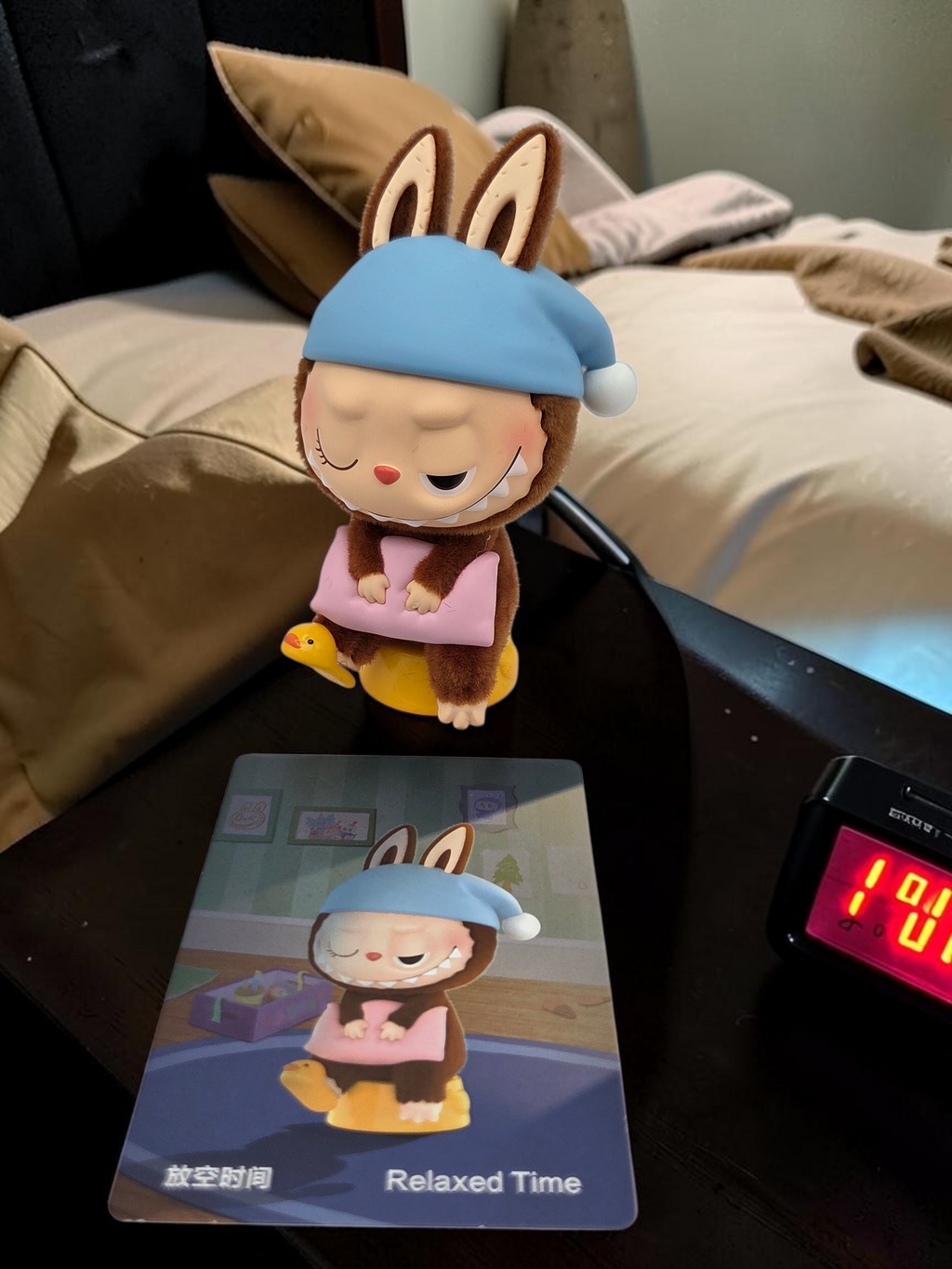 Momof2boyz Shop The Monster's 1:00 am Relaxed Time collectible figure with blue nightcap and pink pillow