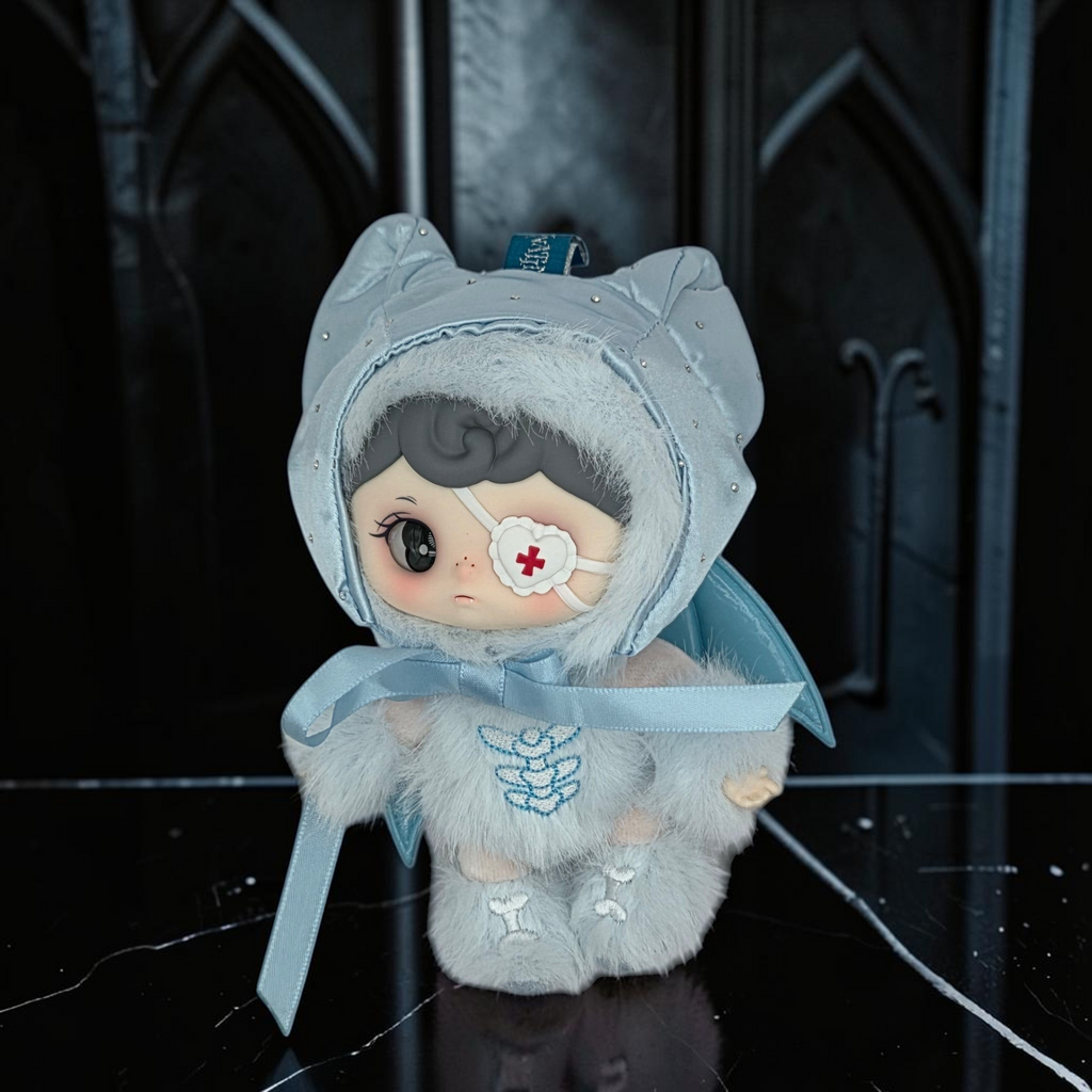 Momof2boyz Shop Silent Haven Tarti collectible plush figure in light blue with an eye patch and faux fur hood