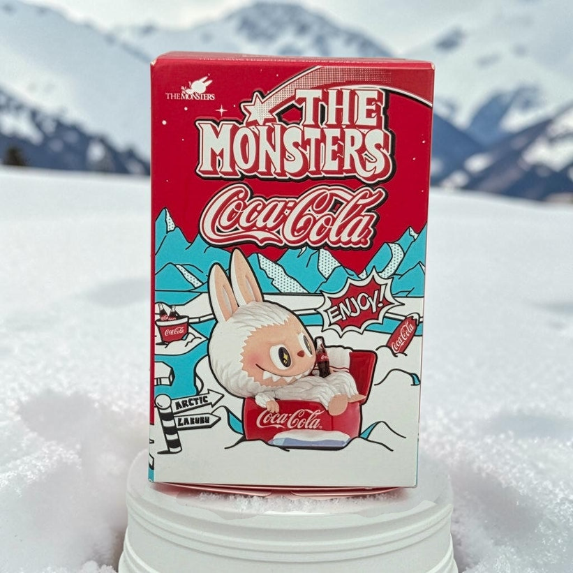Momof2boyz Shop The Monsters Coca-Cola Arctic Labubu figure box featuring a cute white character in a red sled