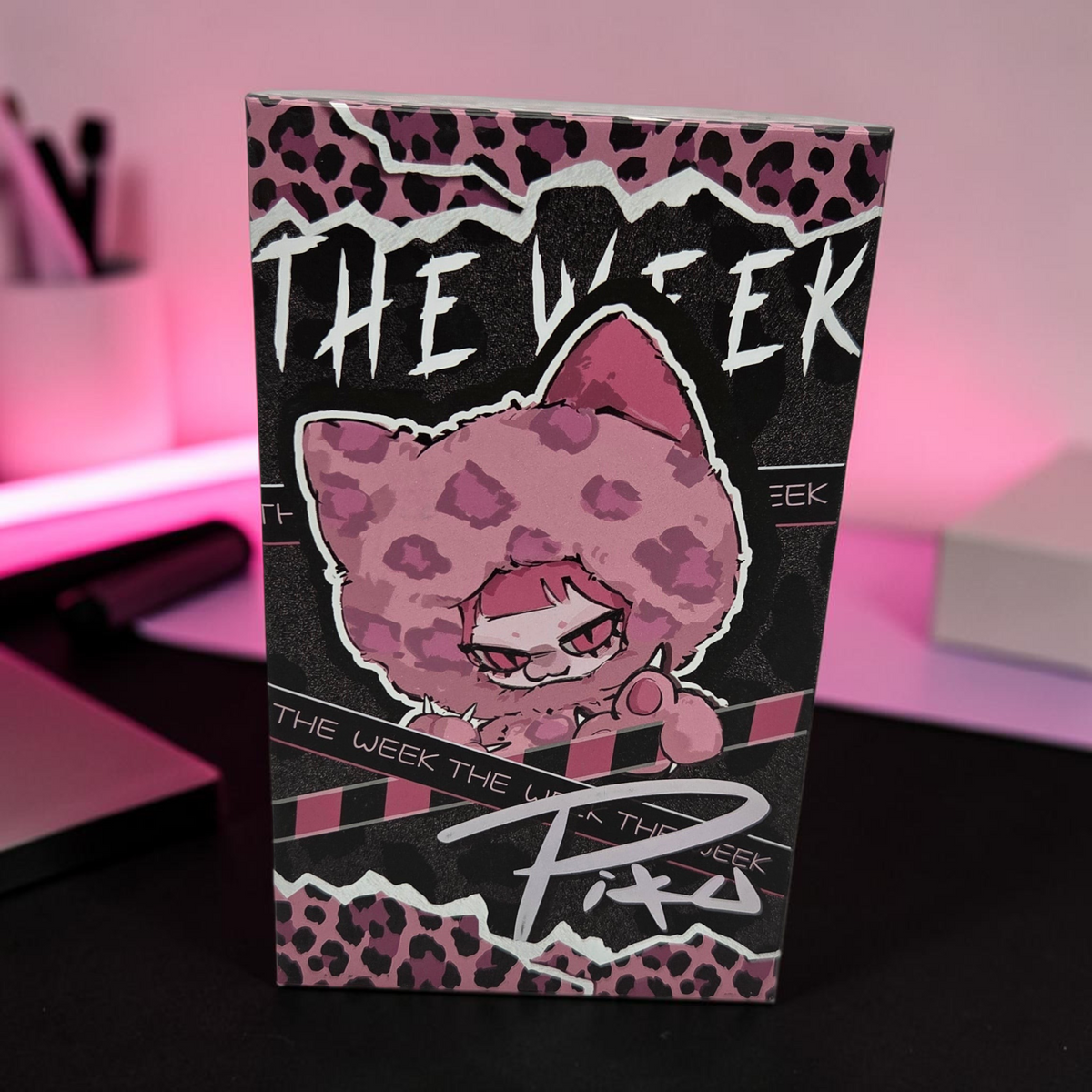 Momof2boyz Shop The Week Series plush toy keychain blind box featuring a pink leopard print character design