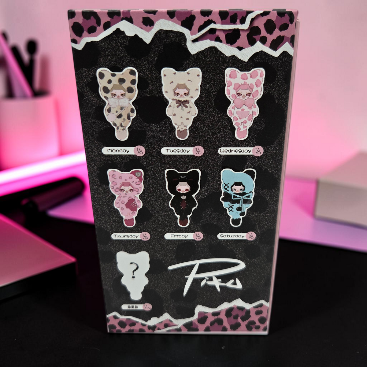 Momof2boyz Shop The Week Series plush toy keychain blind box packaging showing seven collectible character designs