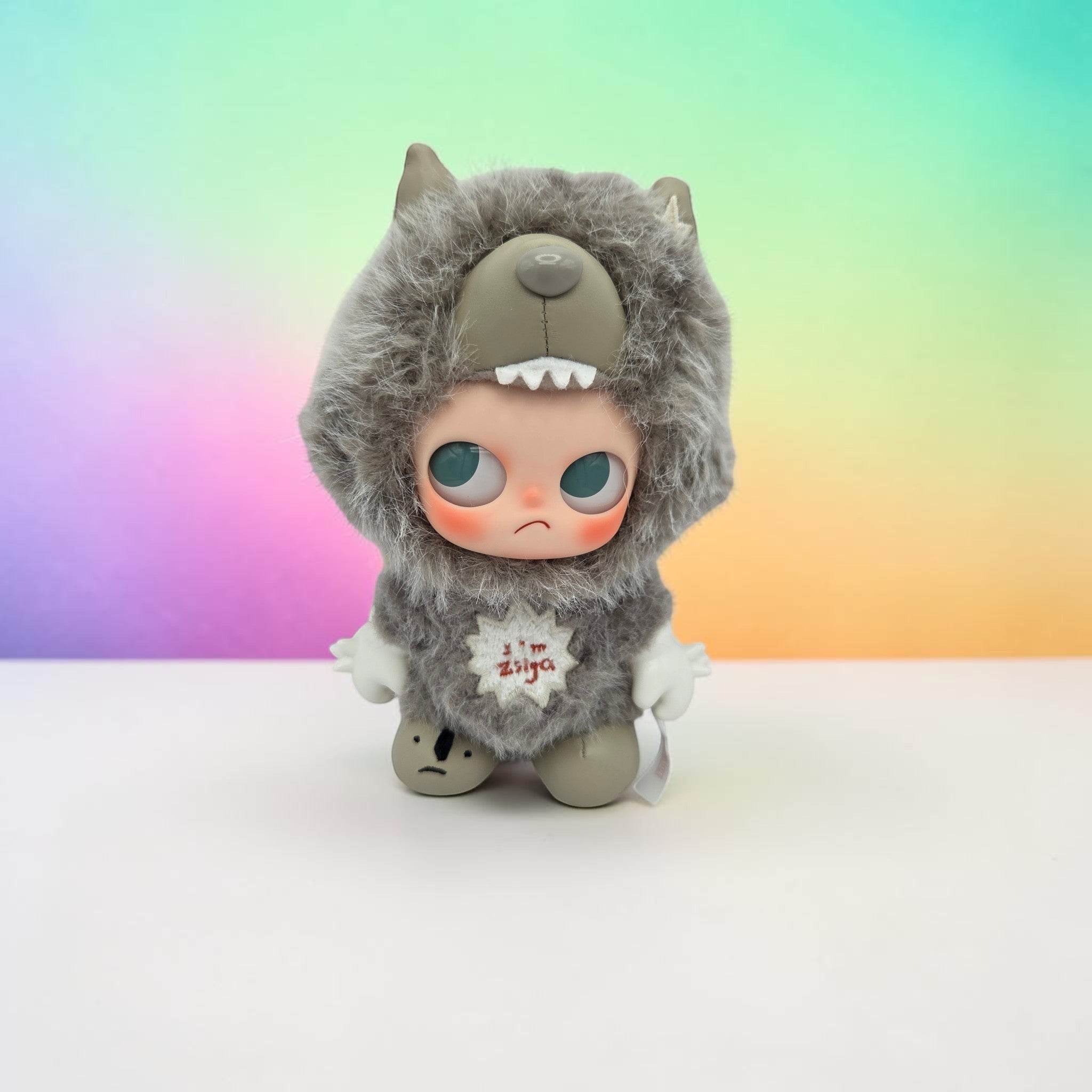 Momof2boyz Shop POP MART Zsiga collectible art toy featuring a grey plush wolf hood and moody expression.