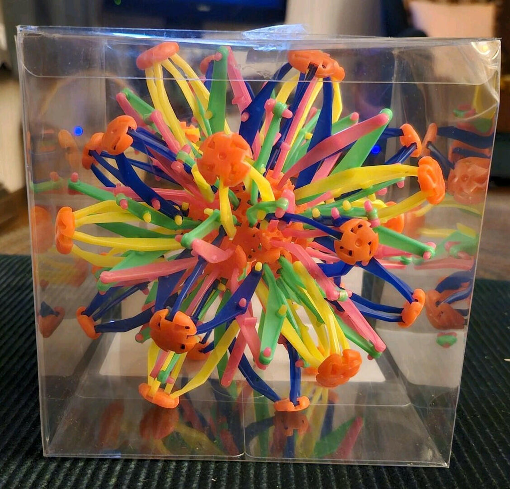 Open Box. ToyPlanet Retract-O Ball Collapsible Multi-Color Plastic Fidget Toy