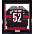 Framed Autographed/Signed Pyotr Kochetkov 35x39 Carolina Black Hockey Jersey JSA COA