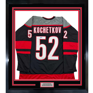 Framed Autographed/Signed Pyotr Kochetkov 35x39 Carolina Black Hockey Jersey JSA COA